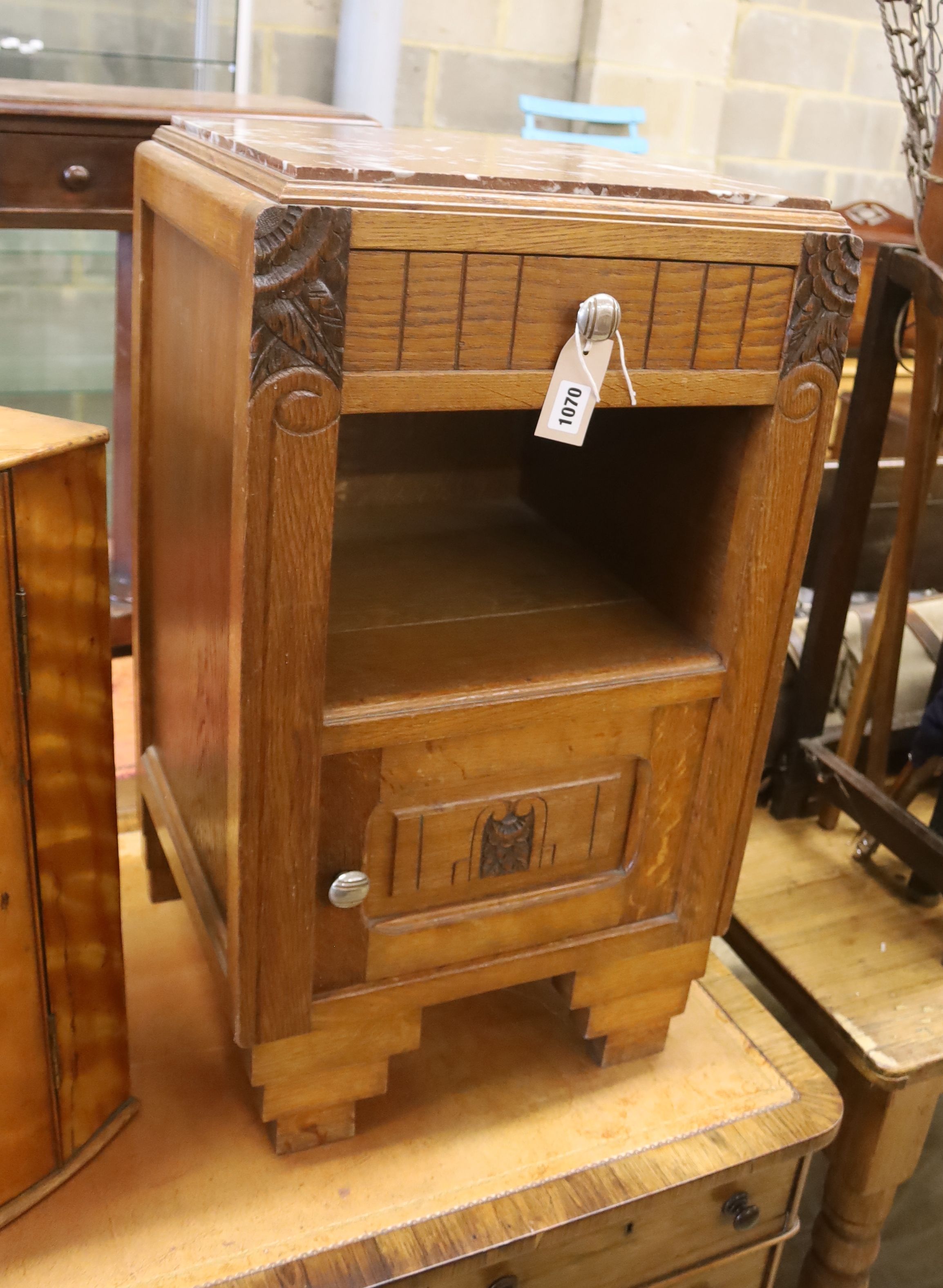 A 1930's French oak marble top bedside cabinet, width 42cm, depth 38cm, height 73cm